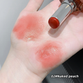 Lipstick shade 02#Naked peach applied on a hand with swatches.