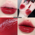 Collage of a red lipstick with close-ups on lips, swatches, and texture.