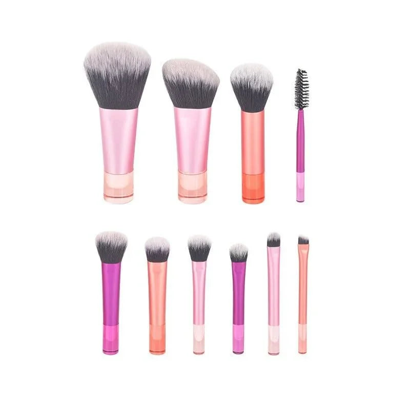 Set of makeup brushes with pink and orange gradient handles on a white background