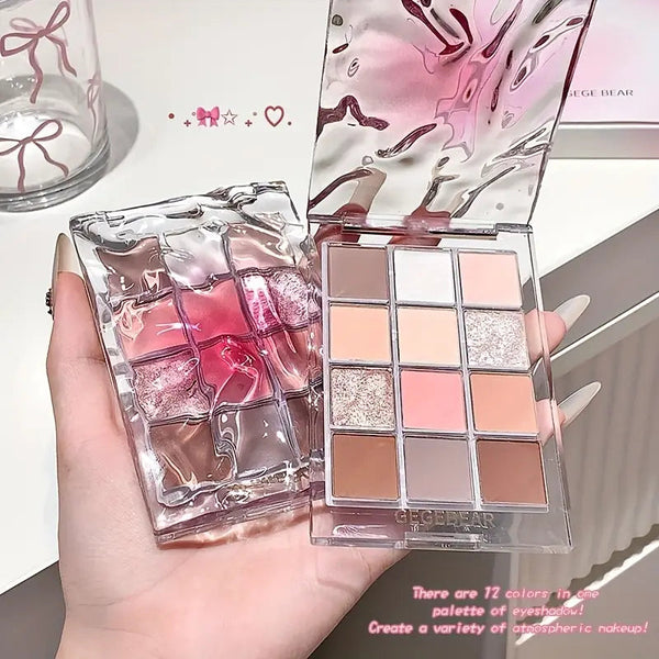 professional eyeshadow palette with 12 colro swatches held by the hand 
