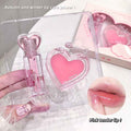 pink lip gloss set by gege bear held by a hand and lip showing the glossy effect after application