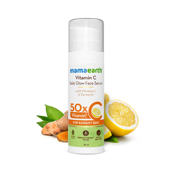 Mamaearth Vitamin C Daily Glow Face Serum with lemon, turmeric, and green leaves on a white background