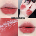 Lipstick swatch on lips, application on skin, and close-up of lipstick texture.