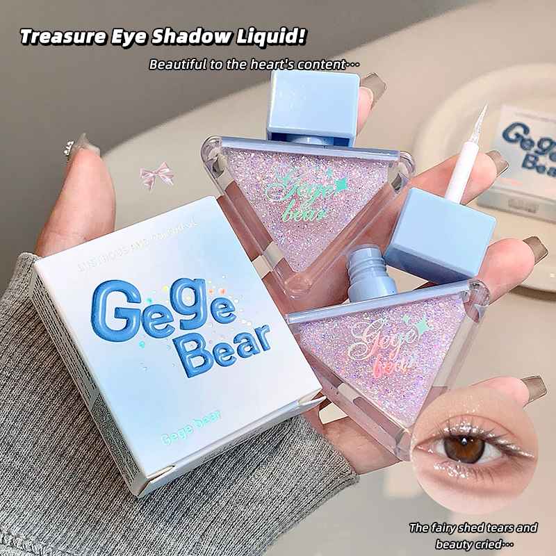 Gege Bear eye shadow liquid with packaging and application on a neutral background