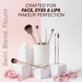 Makeup brushes in a white container with pink flowers on a light background, featuring text about makeup perfection.