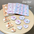 8 Pieces of gege bear beauty blender set  on a table flat laid out 