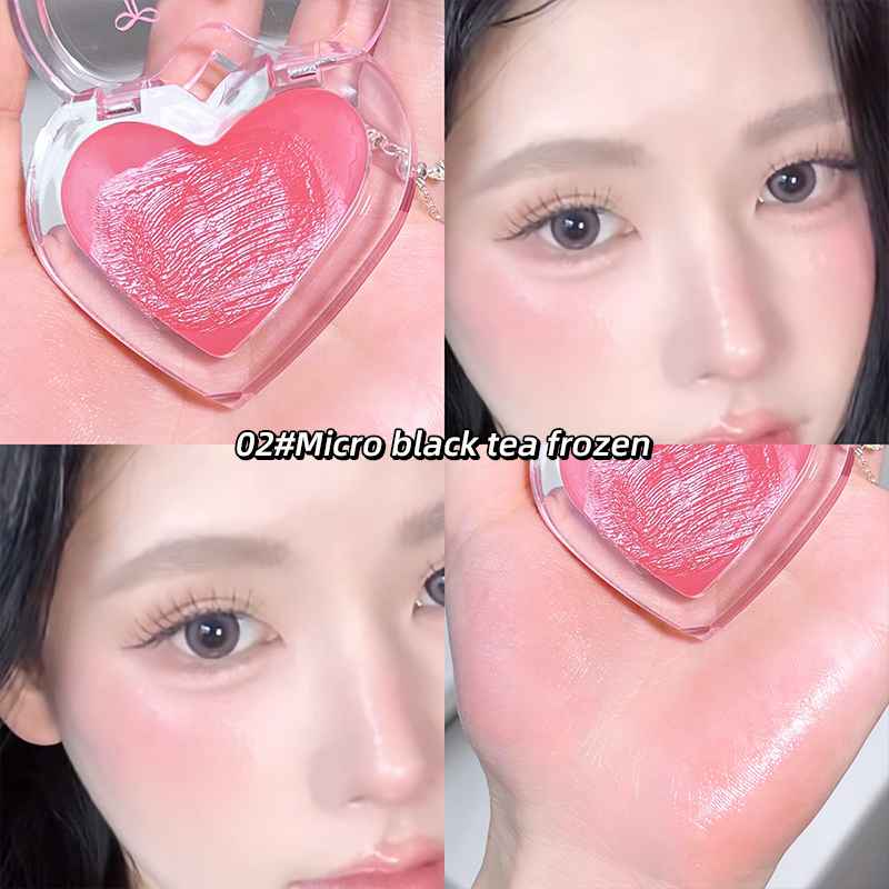 Heart-shaped makeup product with a close-up of a person wearing it on their face and labelled it with 02# micro black tea frozen.