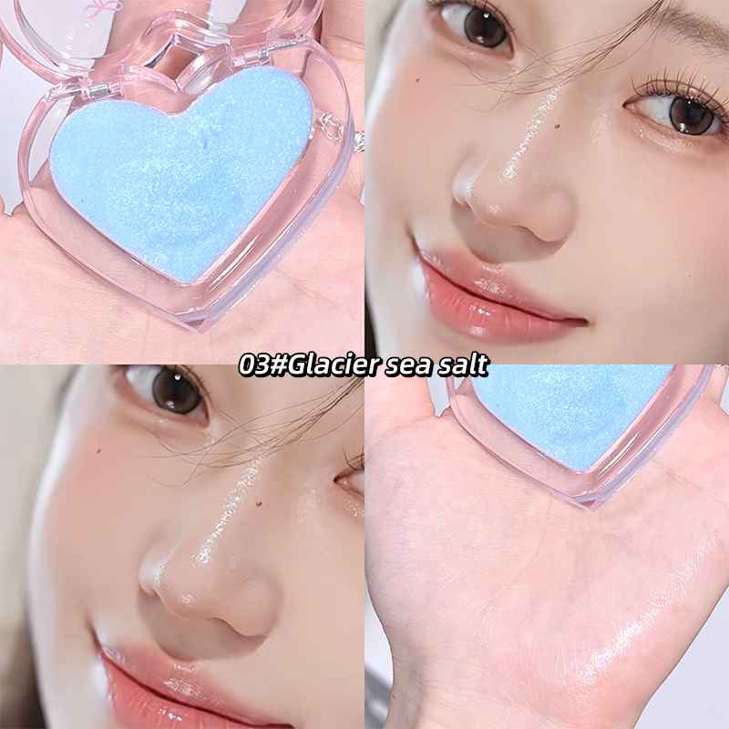 Heart-shaped blue makeup sponge with a close-up of a person using it on their face, labeled '03# Glacier sea salt'.