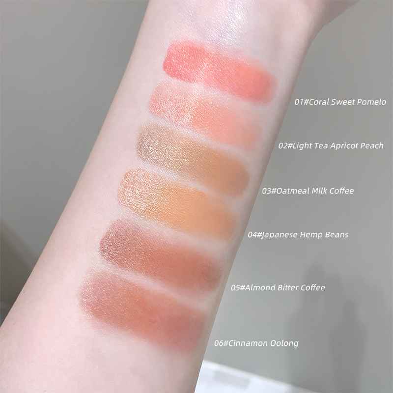 Blush swatches on a person's arm with color names and codes.