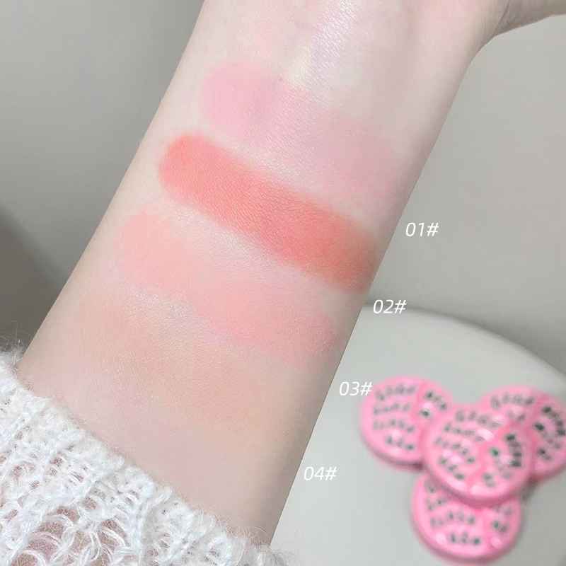 Color swatches of a makeup product on a person's arm with labeled shades.
