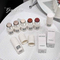 Collection of GEGE BEAR Blushes bottles and boxes on a white surface.