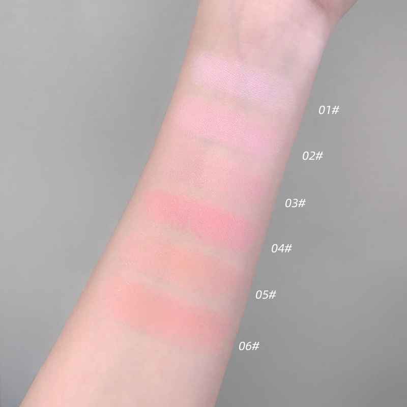 Color swatches on a person's arm with labeled shades against a gray background