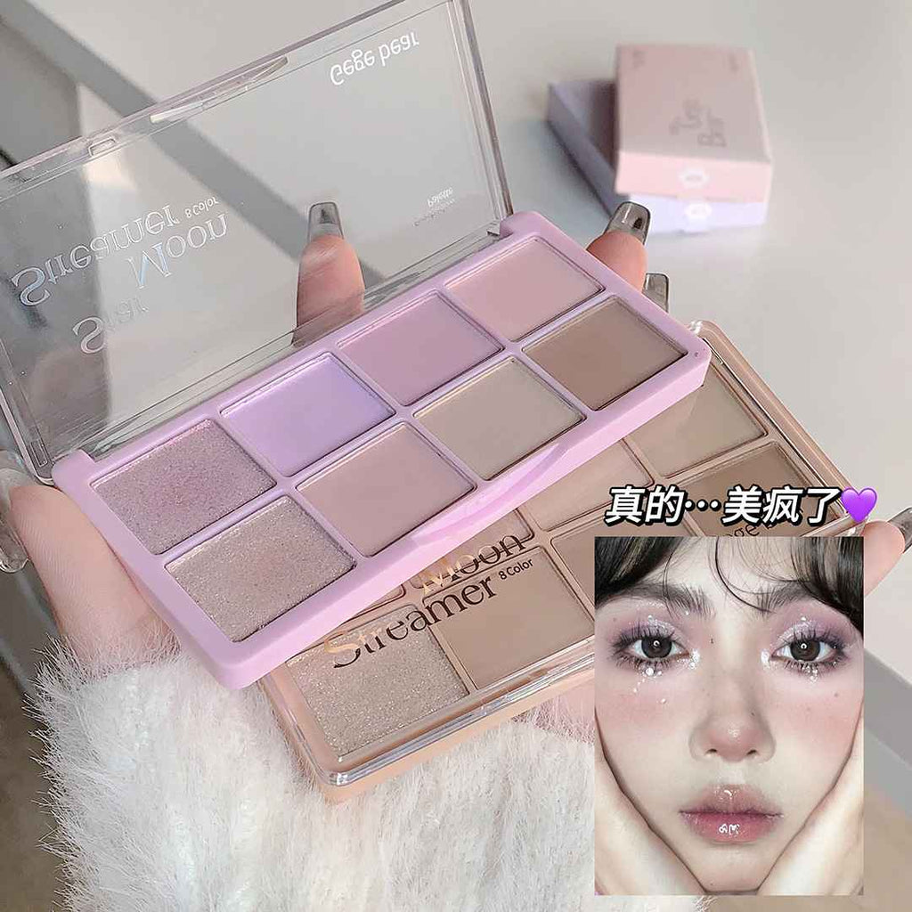 Makeup Eye-shadow palette with a mirror held by a hand, with a blurred face and text overlay on a white background.