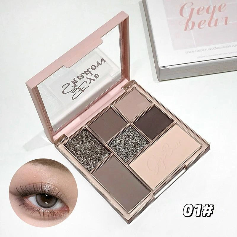 Makeup palette with Swarovski crystals and an eye wearing the product, on a white background.