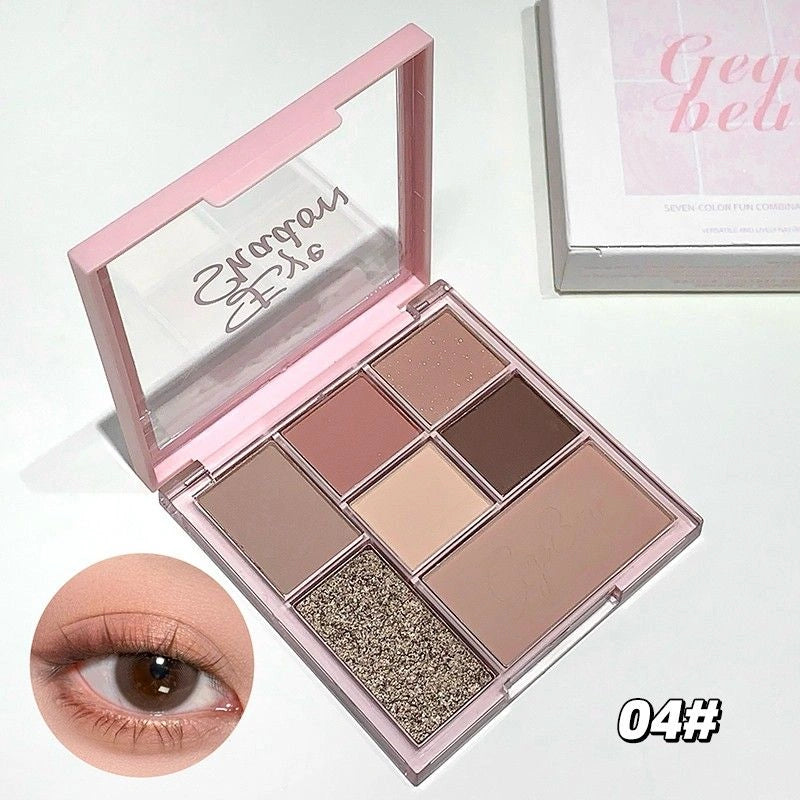 Makeup palette with eyeshadows and a close-up of an eye wearing the makeup.