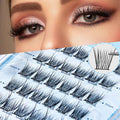 Eyelash extensions on a blue tray with a close-up of a woman's eyes wearing them.