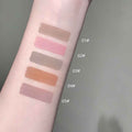 Color swatches on a person's arm with labeled shades against a neutral background