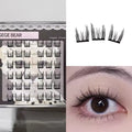 False eyelashes packaging, individual lashes, and an eye wearing the lashes.