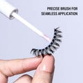 Eyelash extension with a precise brush for application on a light gray background