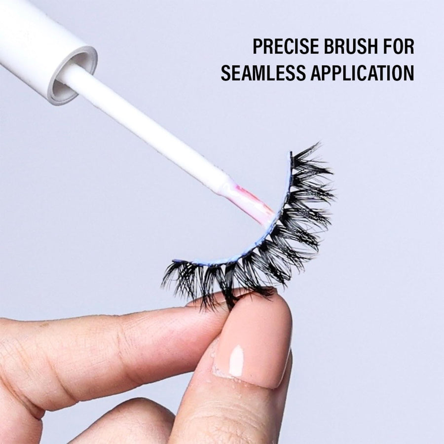 Eyelash extension with a precise brush for application on a light gray background