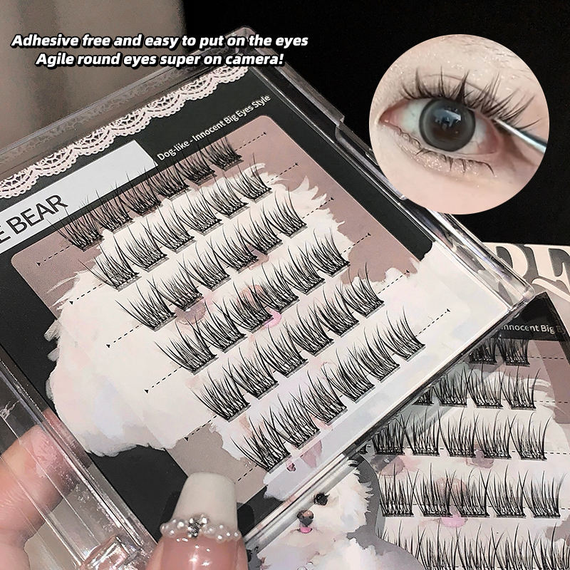 Eyelash packaging with a close-up of false eyelashes on a hand, highlighting adhesive-free application.