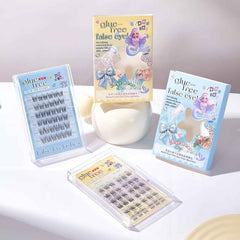 False eyelashes packaging with mermaid design on a white surface