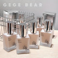 Five pieces of Gege Bear moisturizing foundation arranged on a table in a neat product display, highlighting packaging design and variety.
