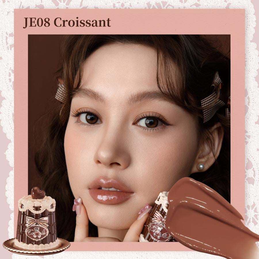 FlowerKnows Sweetie Bear Coating Lip Jelly lip gloss in JE08 Croissant shade applied on lips showing soft warm nude tint and glossy shine effect.