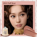Flowerknows Sweetie Bear Coating Lip Jelly lip gloss in JE02 Puff Bear shade applied on lips showing soft tint and glossy shine effect.