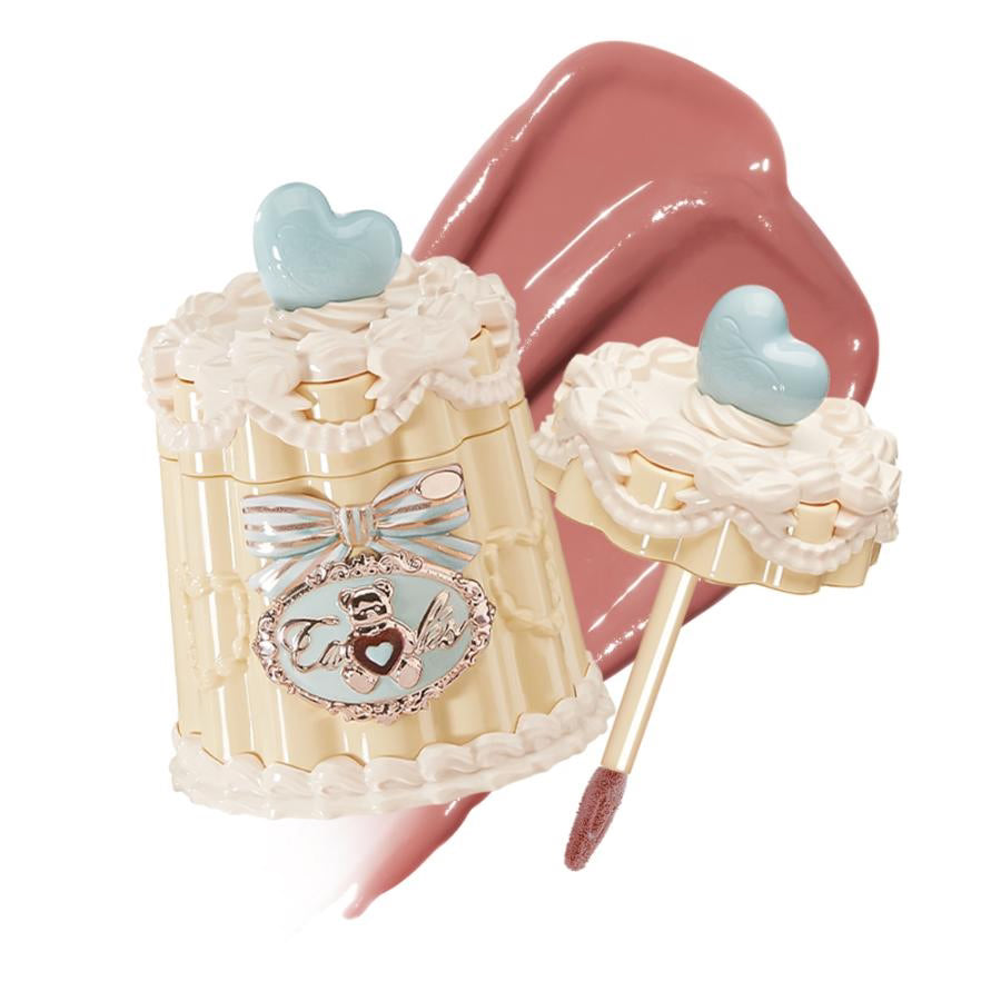 Flowerknows Sweetie Bear Coating Lip Jelly JE03 Peach Tea shade lip gloss swatch showing warm coral peach tint and shiny lip finish on white background.