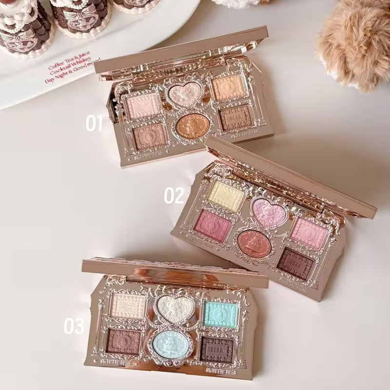 FlowerKnows Sweetie Bear 6-Color Eyeshadow Palette showing all three shades opened on a table with visible matte and shimmer eyeshadow pans in Buttery Croissant, Strawberry Milk, and Mint Chocolate
