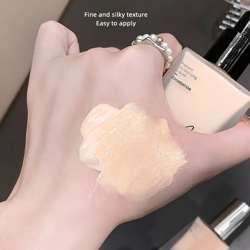 Hand holding a foundation sample with text 'Fine and silky texture Easy to apply' on a dark background
