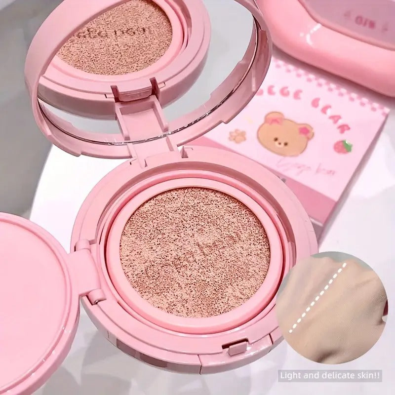 Pink foundation container with a mirror and pink packaging featuring a bear design.