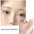 Close-up of a person's face with '04# Vitality Oranges' makeup product on a white background.