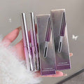 Gee Bear mascara with packaging held by a hand against a neutral background