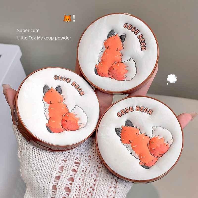 Three 'Geege Bear' fox-themed makeup powder cases held by a hand.