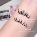 Pair fo Gege Bear glue free false eyelashes stuck on the hand to show the holding strenght and volume of each lashes and closeup to the design