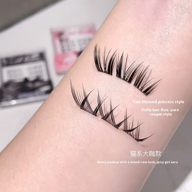 Pair fo Gege Bear glue free false eyelashes stuck on the hand to show the holding strenght and volume of each lashes and closeup to the design