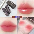 Lip gloss with packaging, applied on lips and skin