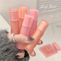 Hand holding pink lip balm tubes with 'Gege Bear' branding in the corner.