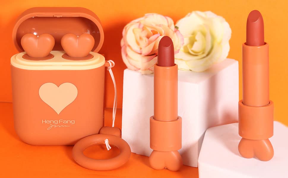 Orange lipstick set with a heart-shaped case on an orange background