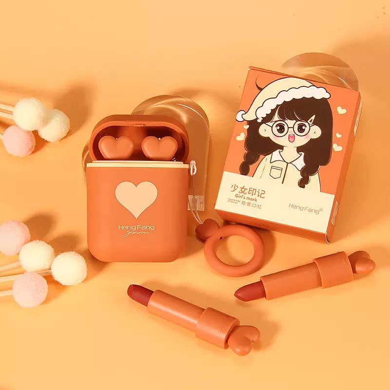 Makeup set with lipsticks, a case, and a mask on an orange background