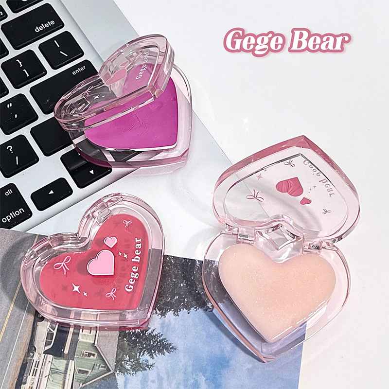 Heart-shaped blush with 'Gege Bear' branding on a laptop keyboard.