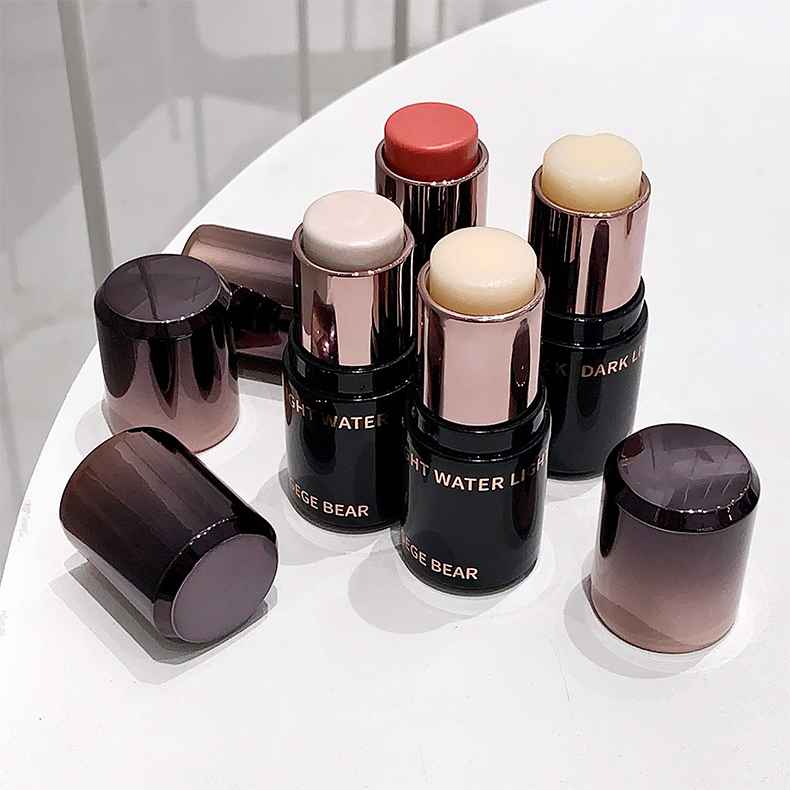 Blush sticks with visible brand name on a white surface