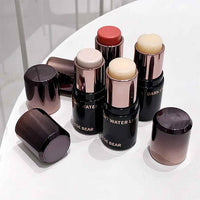 Blush sticks with visible brand name on a white surface