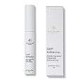 Lash adhesive bottle and packaging on a white background