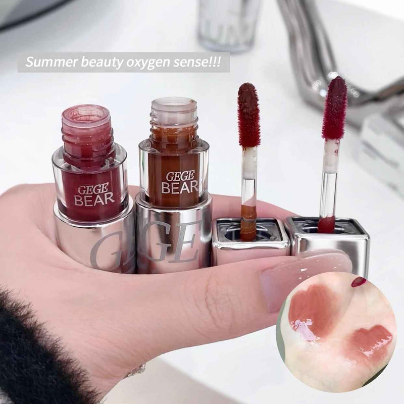Lip Gloss with 'GEGE BEAR' branding held by a hand, with a peach and text overlay on a blurred background.