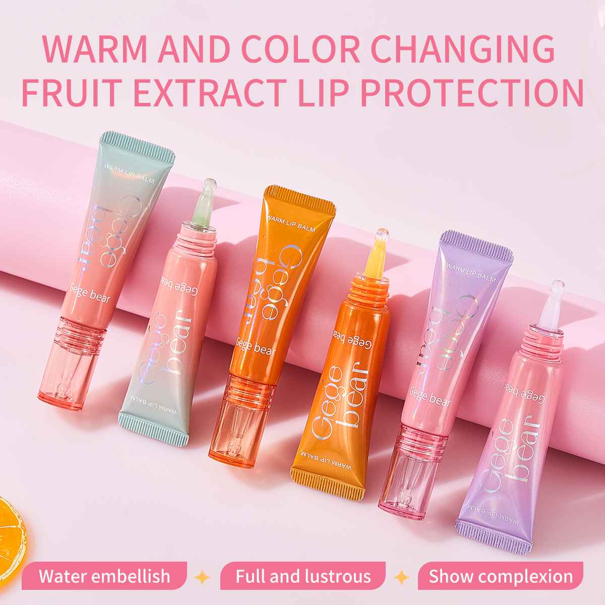 Color-changing fruit extract lip gloss on a pink background
