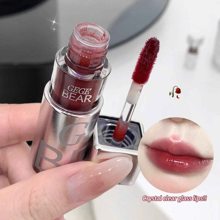 Lipstick with applicator and close-up of lips wearing the color, branded 'GEGE BEAR'.