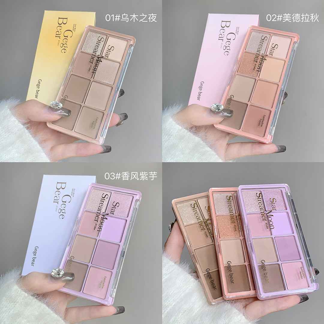 Makeup Eye-shadow palette held by a hand with different color options on a gray background